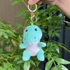 Soft And Cuddly Sitting Dinosaur Plush Toy Cute Keychain Accessory Available In Bright Colors