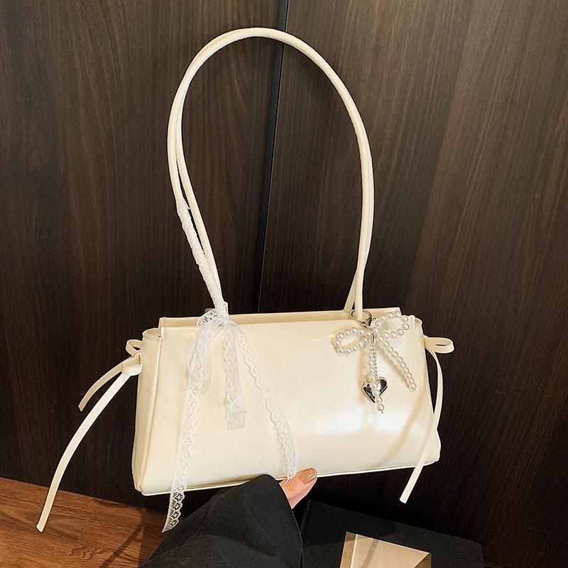 Корейская милая сумка подмышку для девочки 2025 новая модная сумка-подушка с бантом премиальная текстура универсальная сумка через плечо