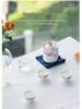 White Porcelain Floral Travel Tea Set: Includes One Pot, Three Cups, and Portable Bag.