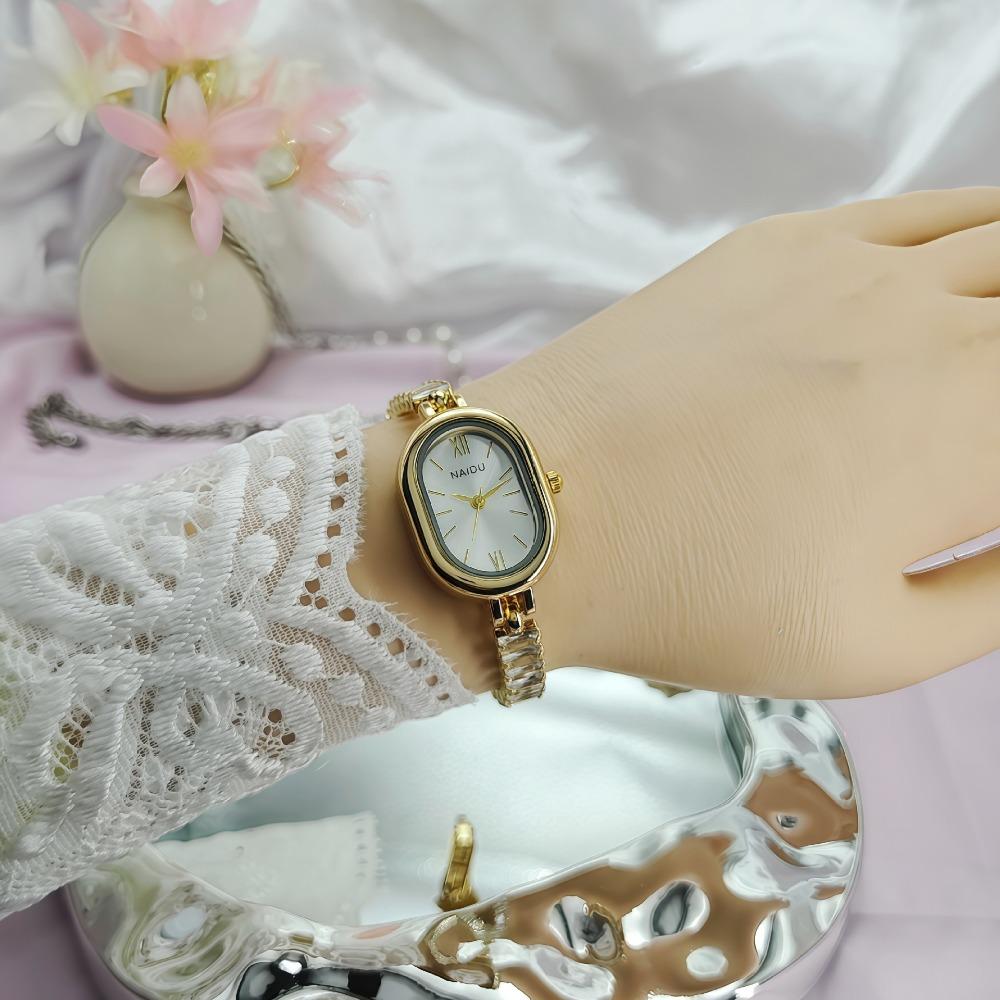 Elegant Ladies Quartz Watch Oval Case Roman Numeral Dial Crystal Decor Metal Link Wristwatch