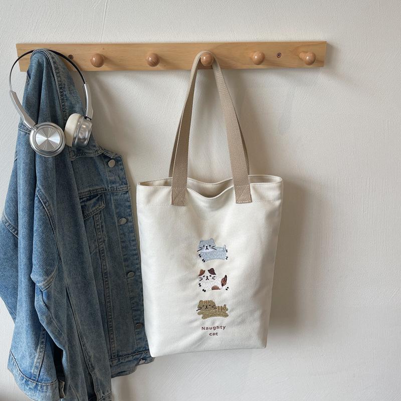 Лето 2025 новая сумка-тоут для поездок на работу, большая вместимость, мультяшная, однотонная, трендовая, нишевая, иностранная сумка через плечо