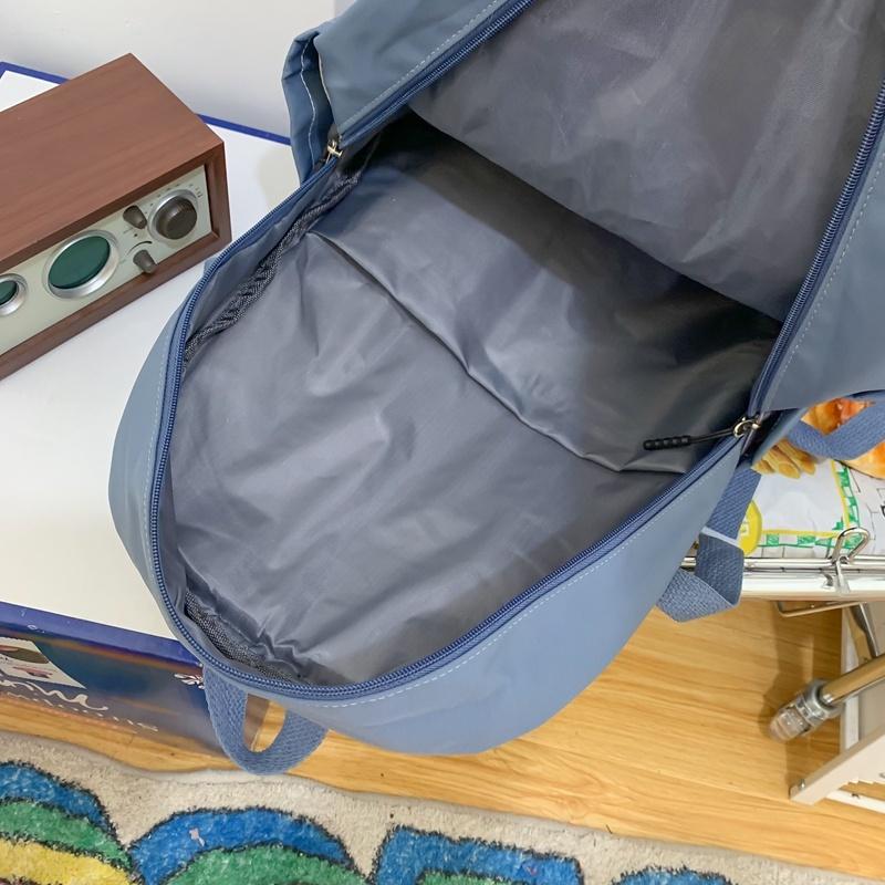 IELGY Korean Version of the Casual Large-capacity Backpack Female Simple Primary School Junior High School Student Bag