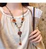 Bohemian Ethnic Distressed Bow Metal Necklace with Versatile Long Round Pendant 2025