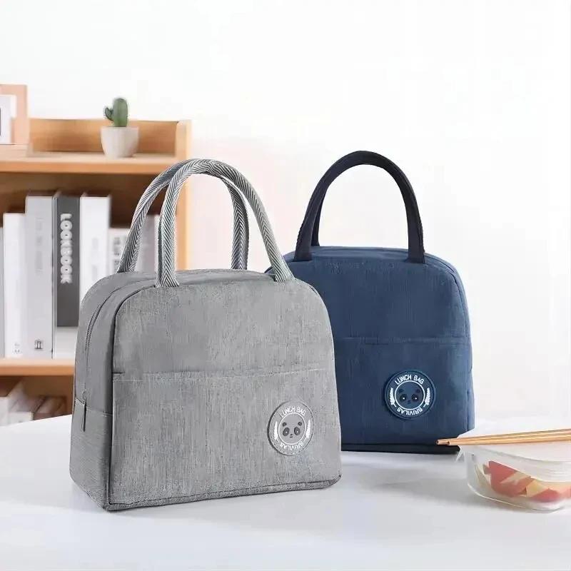 Simple and fashionable heat-insulating and heat-preserving handbag / lunch box. Suitable for students and office workers.