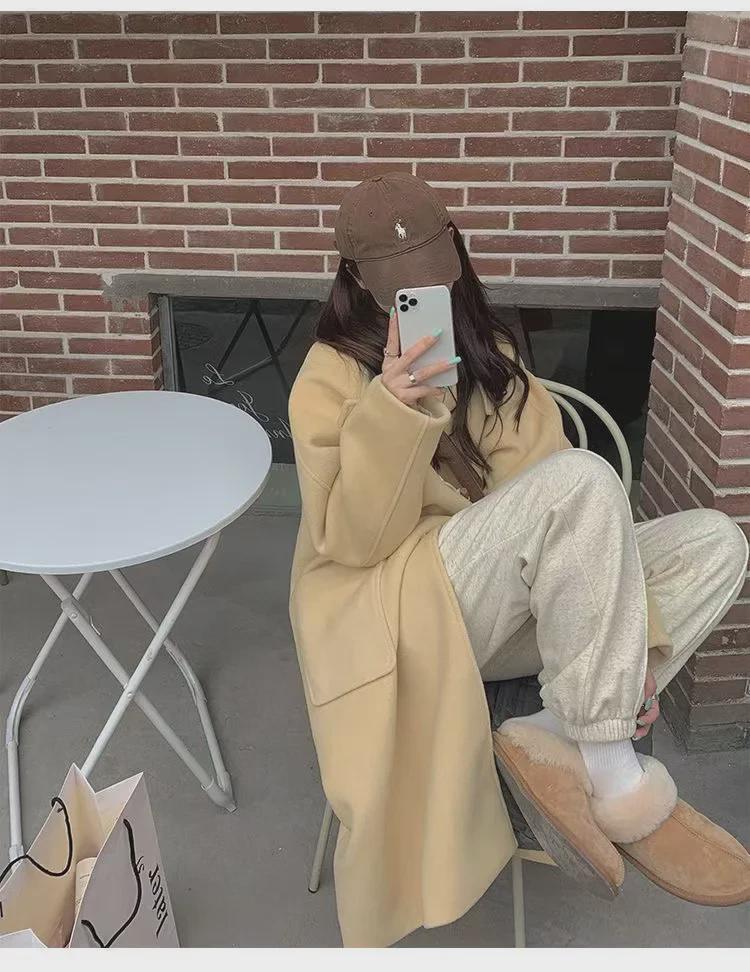 Женское шерстяное пальто средней длины с капюшоном и роговыми пуговицами 2023 года — трендовая осенне-зимняя мода