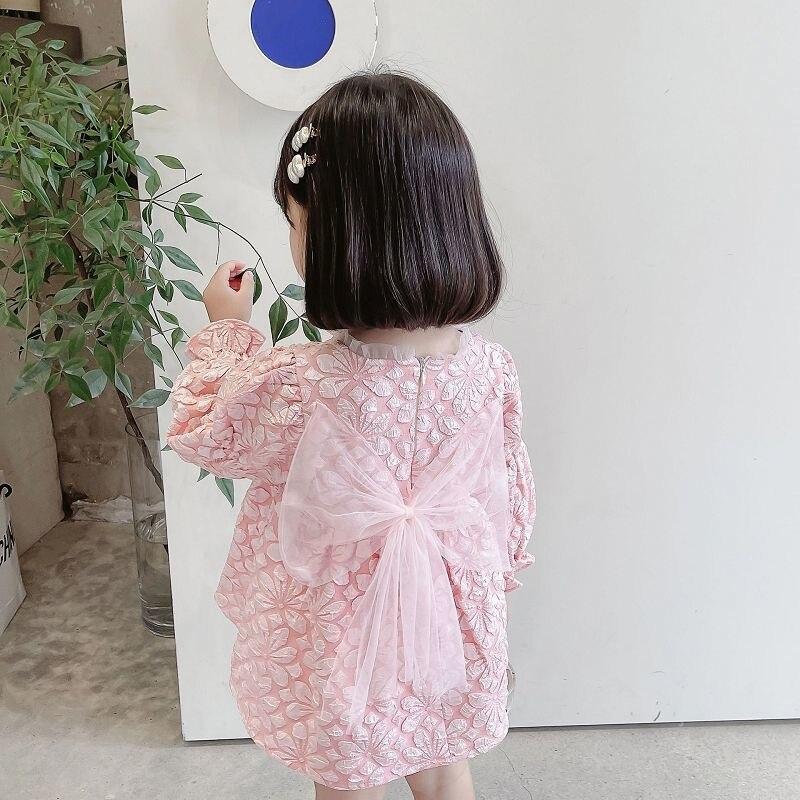 Девушка в западном стиле, сладкое жаккардовое платье с длинными рукавами и бантом