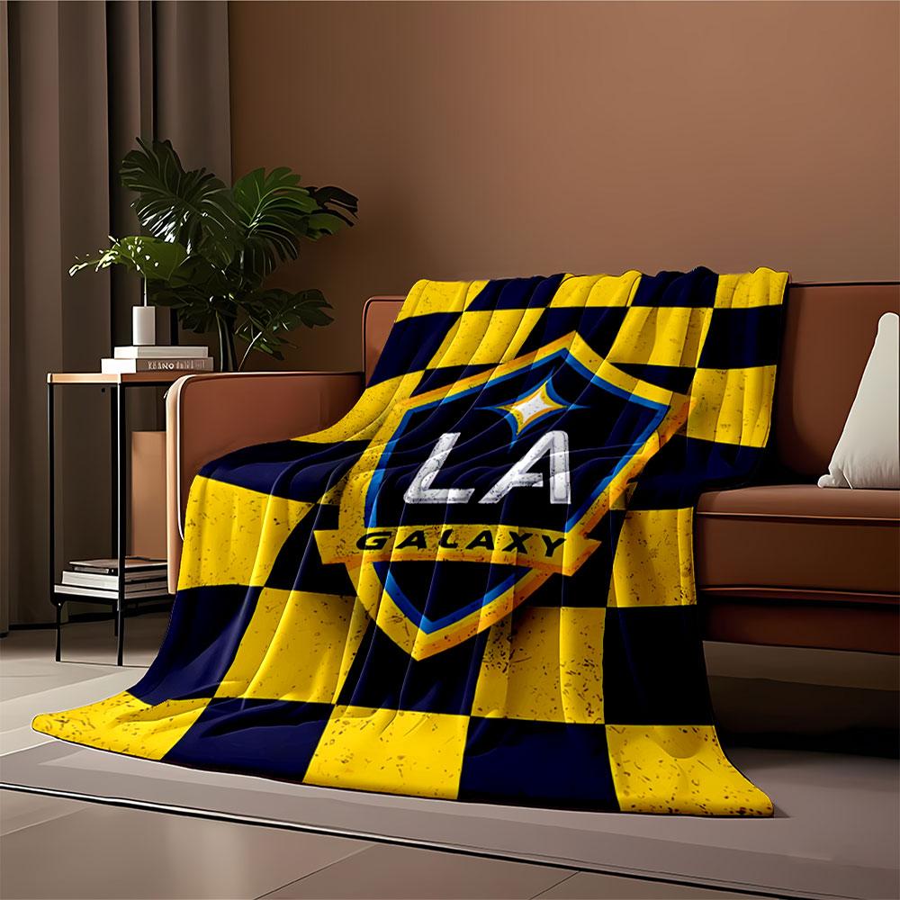 Blue and yellow checkered background with a shield logo in the center. for all seasons blanket lunch break throw gift