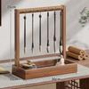 Solid Wood Calligraphy Brush Holder: Desktop Pen Rack with Scholar's Treasures Ornament and Metal Hook Design.