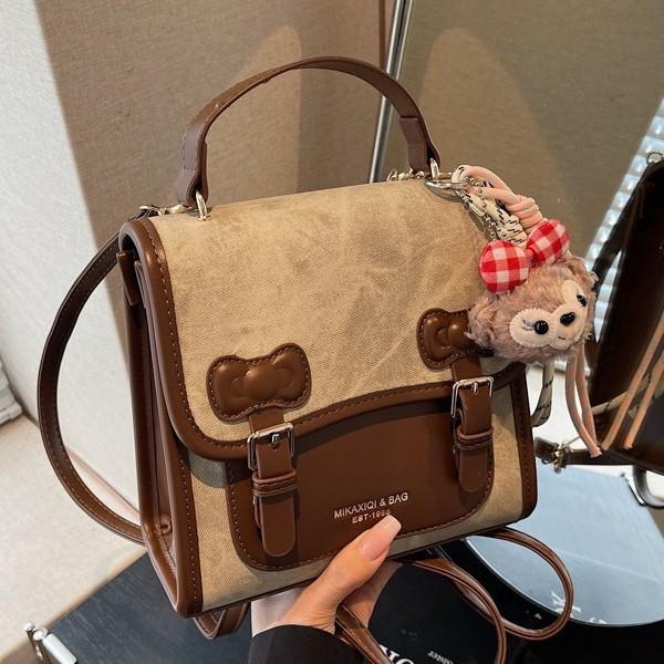 Casual retro women's backpack 2026 new exquisite versatile backpack travel bag mini schoolbag