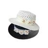 Temperament three-dimensional flower hat women's new summer straw woven hollow breathable big eaves sun protection versatile sun hat