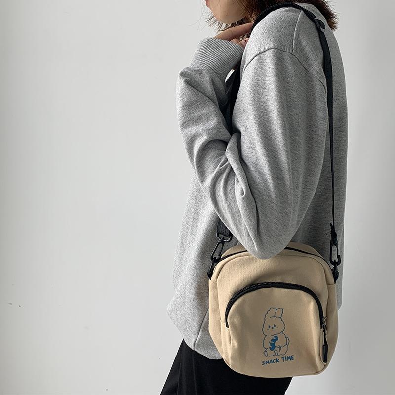 Милая маленькая сумка женская 2025 новая сумка через плечо сто с мультяжной холщовой сумкой