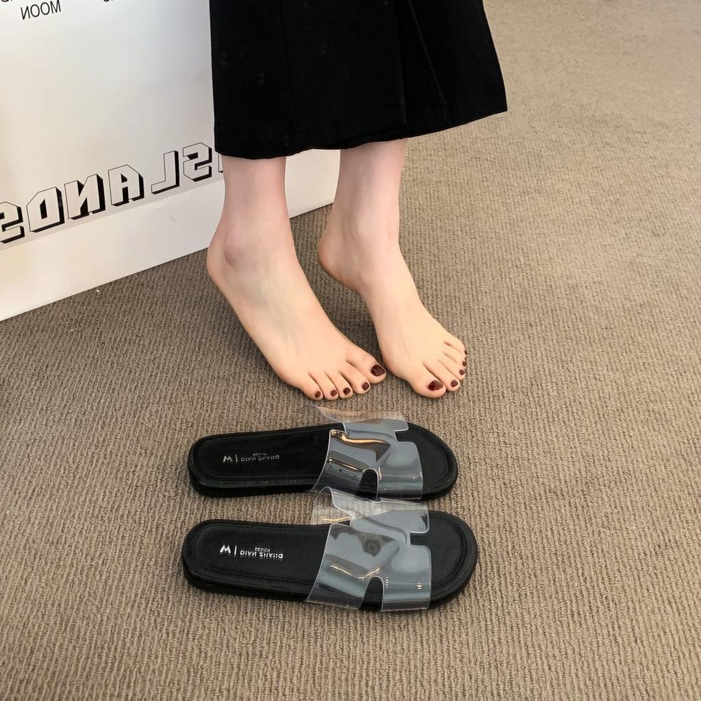 2025 summer new fashion versatile beach vacation flat bottom drag French temperament flat bottom cool slippers transparent word belt