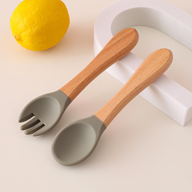 Детская деревянная ручка силиконовая вилка и ложка Главная Дополнительный набор деревянная ручка силиконовая вилка и ложка детская ложка для кормления устойчивая к падениям