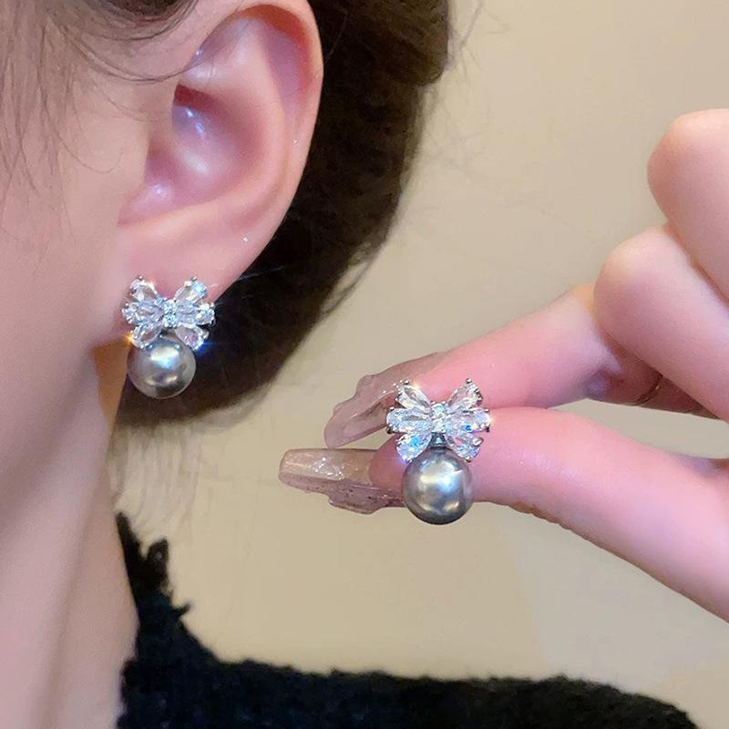 Zircon bow temperament pearl no earrings earrings women's niche design earclips mosquito coil disc high-end earrings