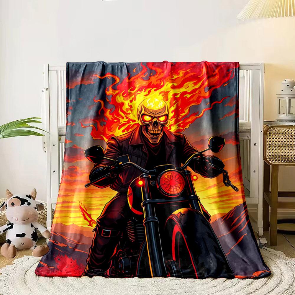 A fiery figure rides a motorcycle, surrounded by vivid flames and sunset. for all seasons blanket lunch break throw gift
