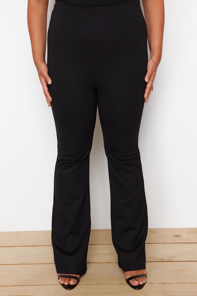 Женские стильные черные трикотажные брюки с расклешенной талией больших размеров для похудения