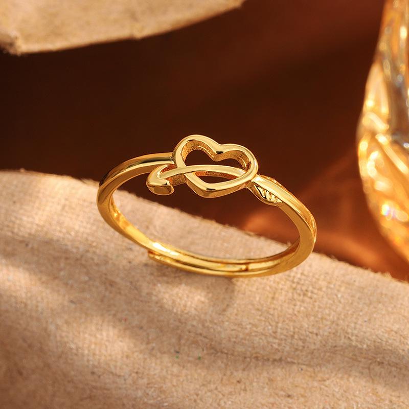 Exquisite New Year Style Hollow Heart Ring: Trendy Woman's Design with Arrow Through the Heart.