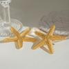 1 пара серег в форме пятиконечной морской звезды, яркая золотистая металлическая текстура, подчеркивающая изысканное и благородное чувство