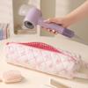 Bow-design hair tool storage bag with zipper. Dustproof for hair dryers and styling tools, ideal for travel and daily use.
