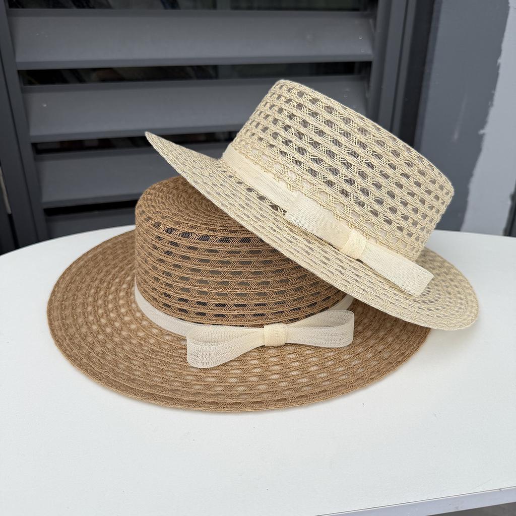 Spring and summer new hollow seaside photo hat women's beach vacation sunshade straw hat big edge flat top sunscreen top hat
