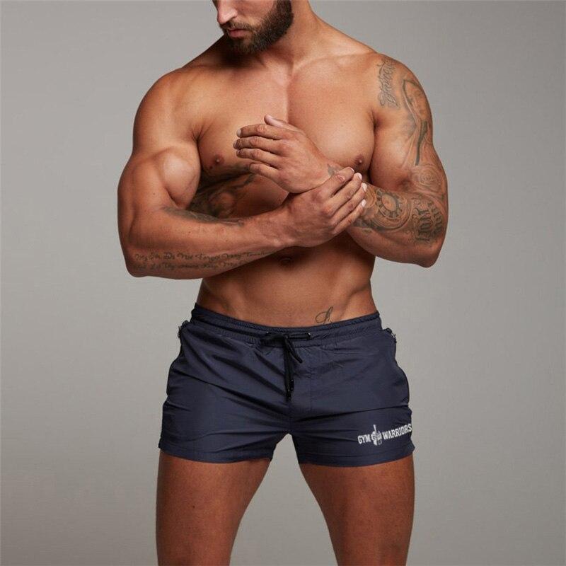 Muscleguys Летние мужские модные спортивные шорты для бега, шорты для тренажерного зала, фитнеса, бодибилдинга, мягкие эластичные шорты на талии, дышащие и впитывающие пот