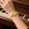 A Women's Light Luxury Retro Oval-Shaped Quartz Watch with Diamond-Encrusted Fine Chain and Steel Band, Suitable for Commuting and Gentle Date Wear