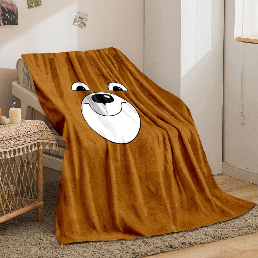 A smiling cartoon bear face on a brown background. for all seasons blanket lunch break throw gift