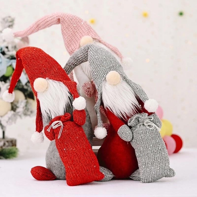 Gnome Santa Claus with a large Christmas bag