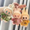The First and Second Generation Keychains Labubu Clothes Pendants Rabu Cloth Sitting Party Bear Scarf Hat