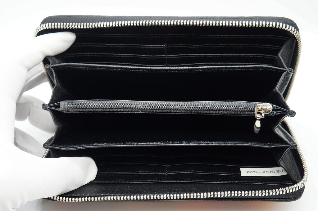 Оранжевый длинный кошелек для мужчин и женщин, изготовленный из цельного куска натуральной кожи крокодила. Имеет золотую круглую застежку-молнию, кошелек для монет, большой