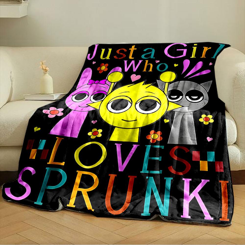 Three cartoon characters with colorful text and flowers on a black background. for all seasons blanket lunch break throw gift