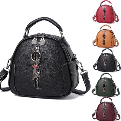 Женская полиуретановая сумочка с ремешком через плечо