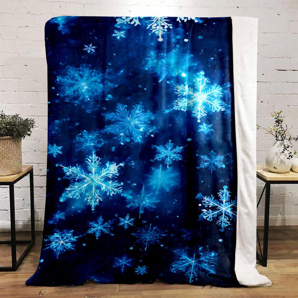 Glowing blue snowflakes scattered on a dark, starry background. for all seasons blanket lunch break throw gift