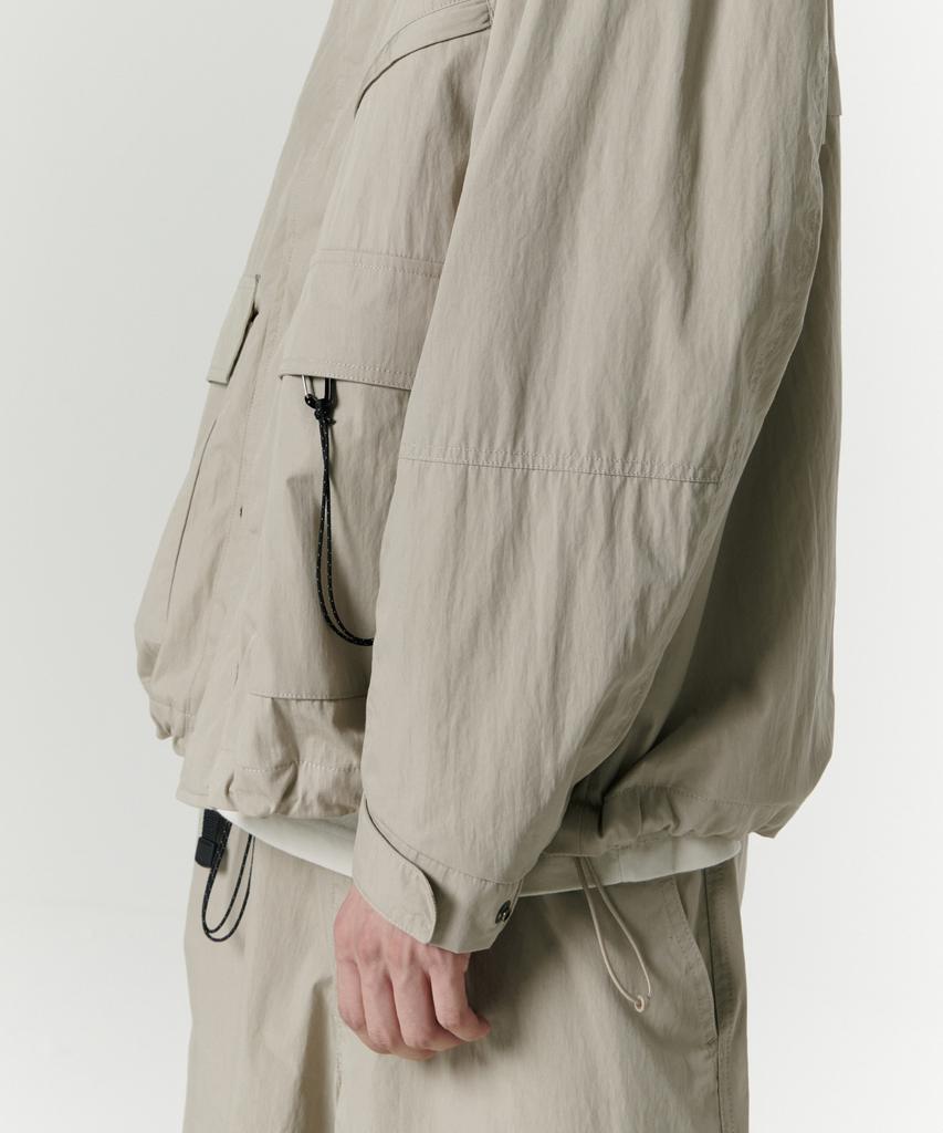 Musinsa Standard [City Leisure] Cn Hooded Windbreaker Jacket [Grayish Beige]