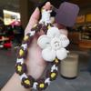 Smiley face flower woven mobile phone lanyard women's ins fragrant wrist short hand-woven boutique small fresh