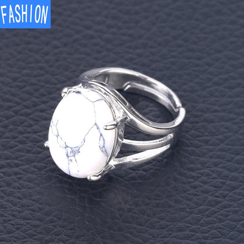 Oval Natural Crystal Four-claw Inlaid Hollow Ring