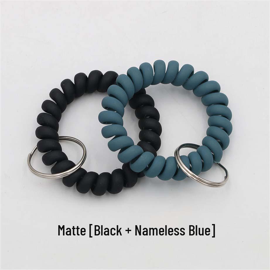 Минималистичный браслет-брелок и резинка для волос в виде пружинного механизма