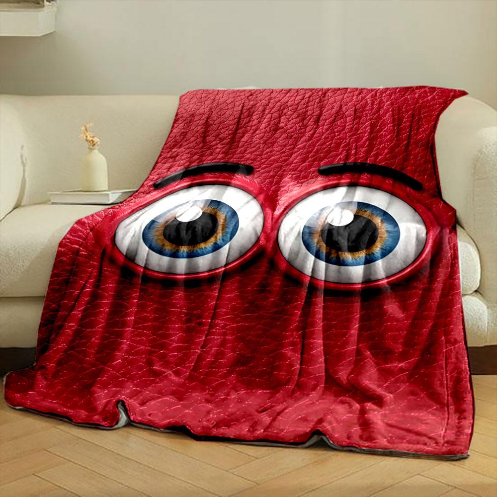 Blue cartoonish eyes on a textured red leather-like background. for all seasons blanket lunch break throw gift