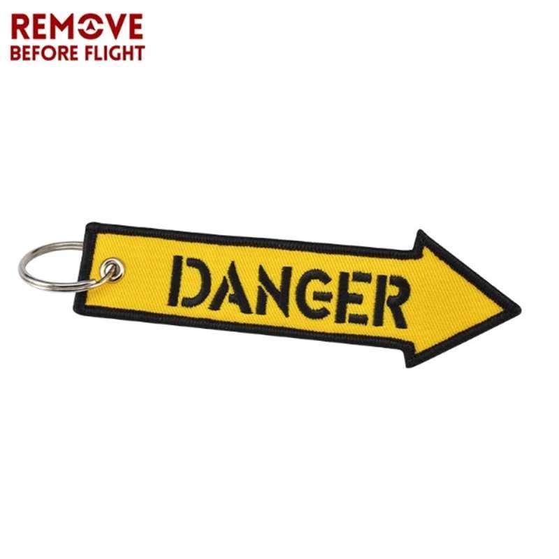 Удалите перед полетом желтый брелок с вышивкой в ​​виде буквы опасности, ремешок для ключей, брелок