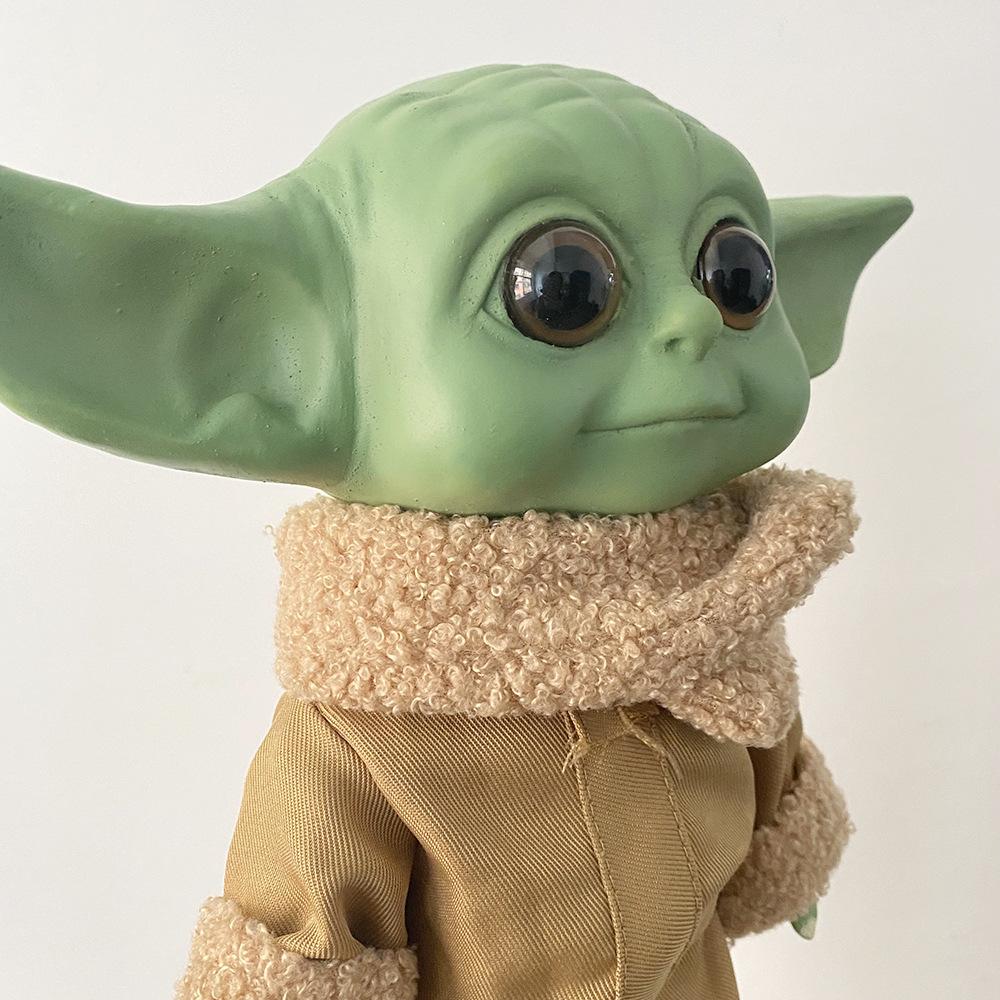 Star Wars merchandise: Yoda baby figurine, infant Yoda vinyl doll, Mandalorian action figure