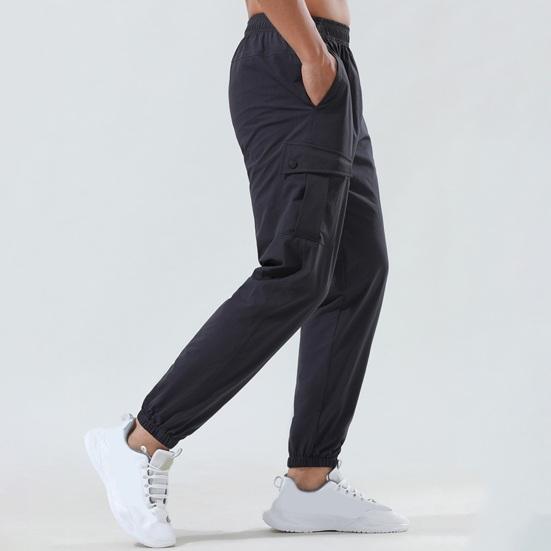 Men Pants Elastic Waist Quick-drying Loose Solid Color Pockets Stretchy Daily Wear Casual