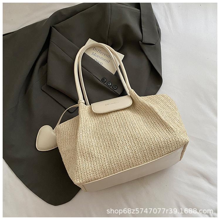 Straw bag women's 2025 new seaside woven handbag niche crossbody bag versatile tote bag is popular this year