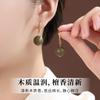 Wooden earrings made of green sandalwood, natural agarwood, and wood, with hook-shaped sandalwood pendants, in a new Chinese style