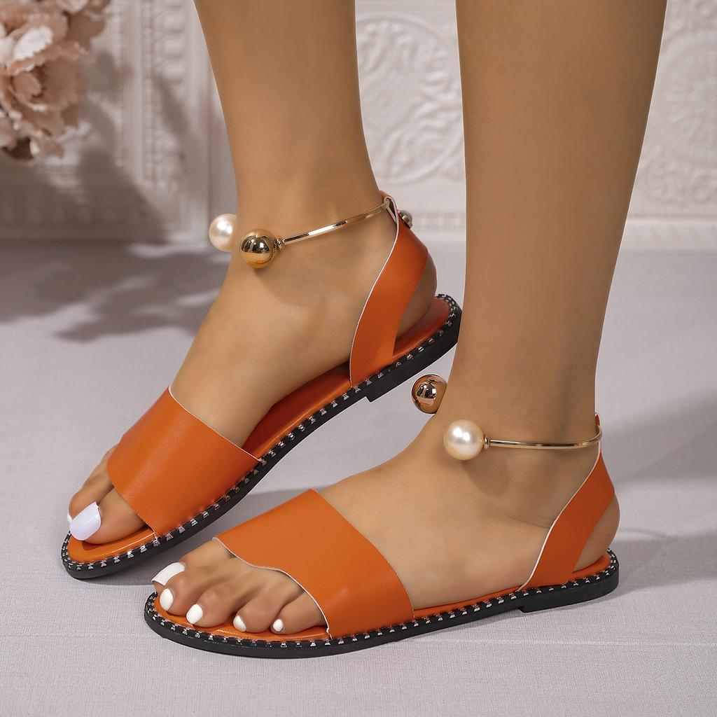 European and American one-word buckle flat sandals women's new open-toed simple pearl metal buckle cool slippers