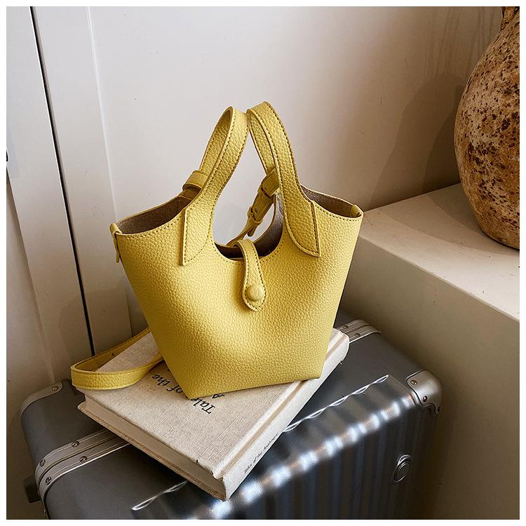 Оптовая продажа 2025 новая нишевая сумка-тоут с узором личи, женская корейская версия, простая сумка-ведро, повседневная сумка-мессенджер