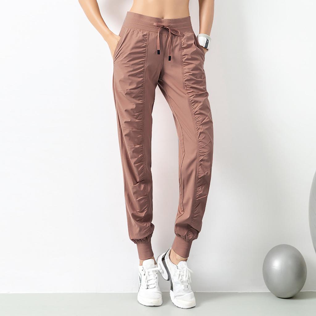 Женские быстросохнущие спортивные брюки-джоггеры с затягивающимся шнурком на талии и боковыми карманами — облегающий крой, дышащая смесь полиэстера для бега и тренировок
