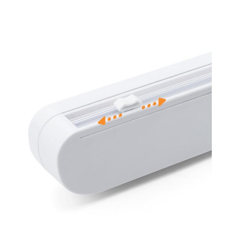 Диспенсер для пластиковой пленки с резаком. Многоразовый диспенсер для пищевой пленки с выдвижным резаком. Содержит рулон пищевой пластиковой пленки длиной 12 дюймов.