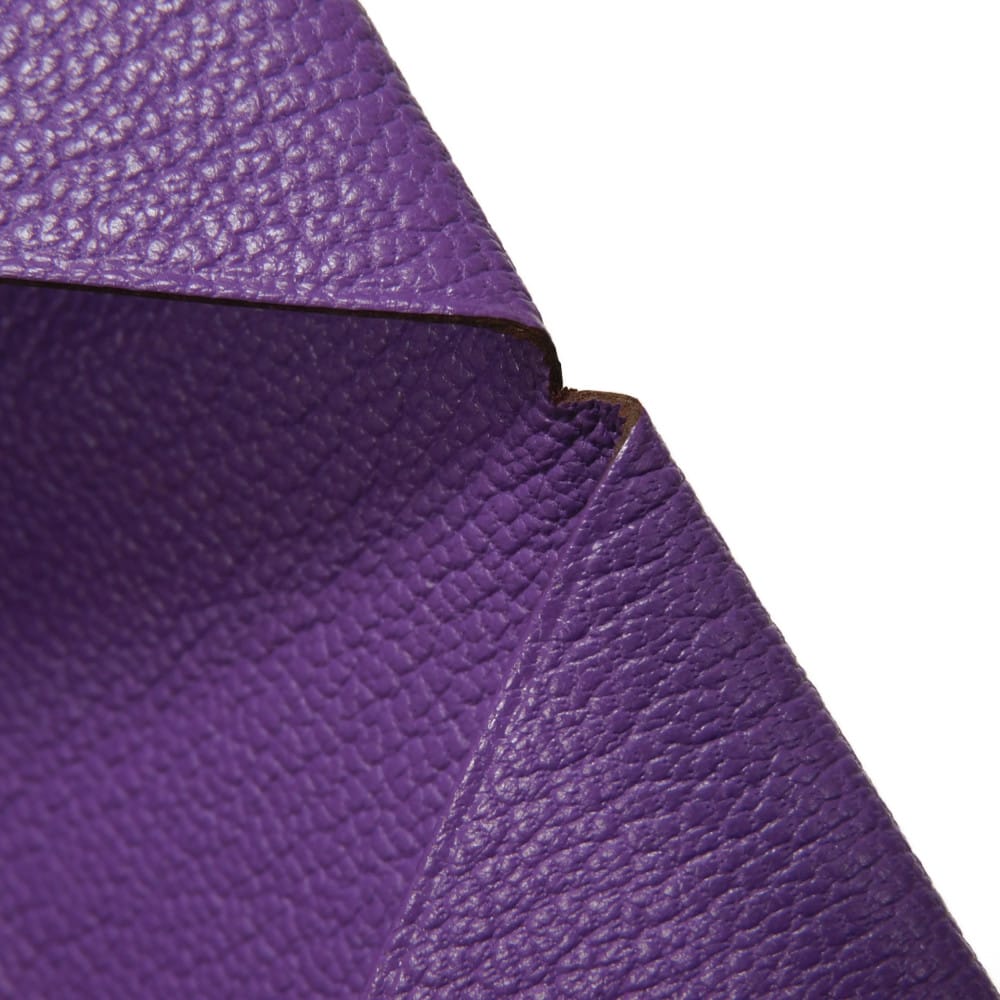 Used 9212 Calvi 7946 Chevre Mysore goatskin bag with gold-stamped logo and purple snap buttons. Excellent condition.