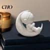 3D Printed Astronaut Figurine Moon Figurine, Sitting on Crescent Spaceman Office Desk Statue, Desktop Decoration for Home Bookshelf PLA