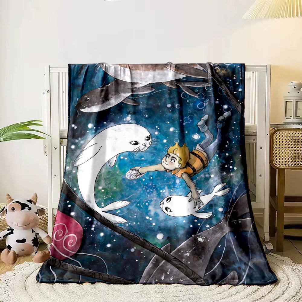 A boy swims underwater with seals amid bubbles and a colorful backdrop. for all seasons blanket lunch break throw gift